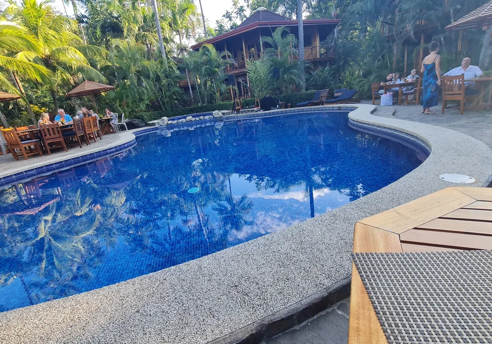 Boutique Costa Rica hotel pool surrounded by tropical rainforest gardens